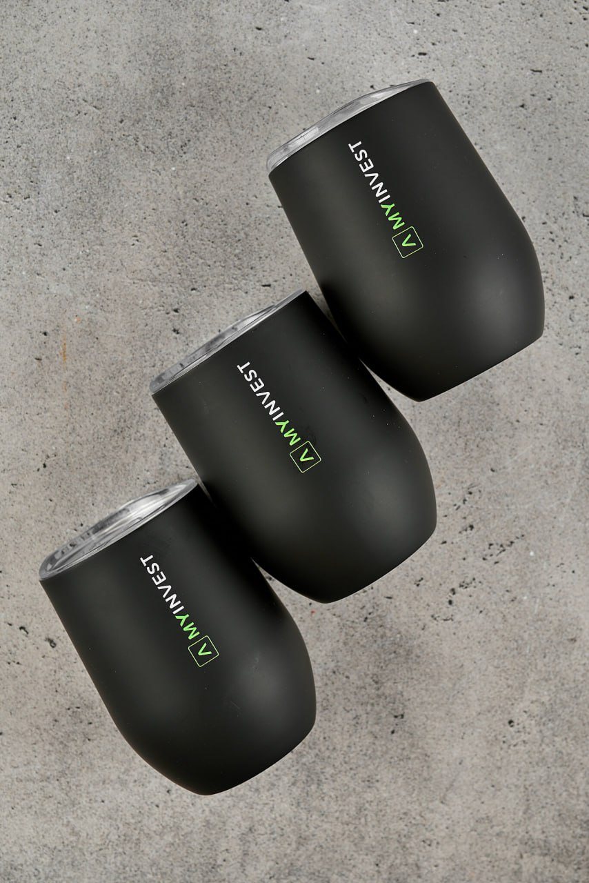 Three MyInvest tumblers on concrete